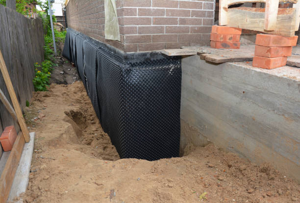 Happy homeowners after waterproofing job in Linden